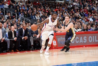 LOS ANGELES, CA - NOVEMBER 3:  Reggie Bullock #25 of the Los Angeles Clippers handles the ball against the Utah Jazz on November 3, 2014 at Staples Center in Los Angeles, California. NOTE TO USER: User expressly acknowledges and agrees that, by downloadin