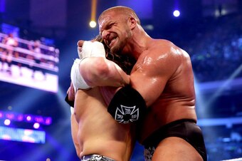 Triple H sets up the Tiger Suplex