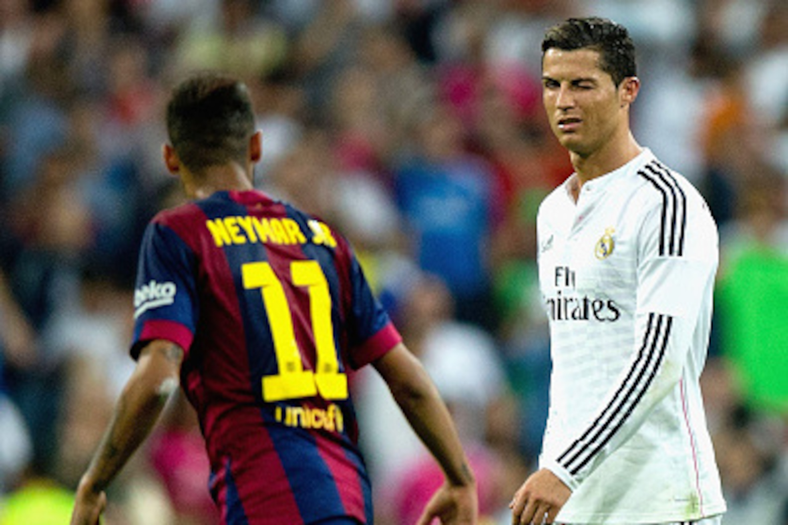 MADRID, SPAIN - OCTOBER 25: Cristiano Ronaldo of Real Madrid CF winks at Neymar of Barcelona  during the La Liga match between Real Madrid CF and FC Barcelona at Estadio Santiago Bernabeu on October 25, 2014 in Madrid, Spain.  (Photo by Gonzalo Arroyo Mor