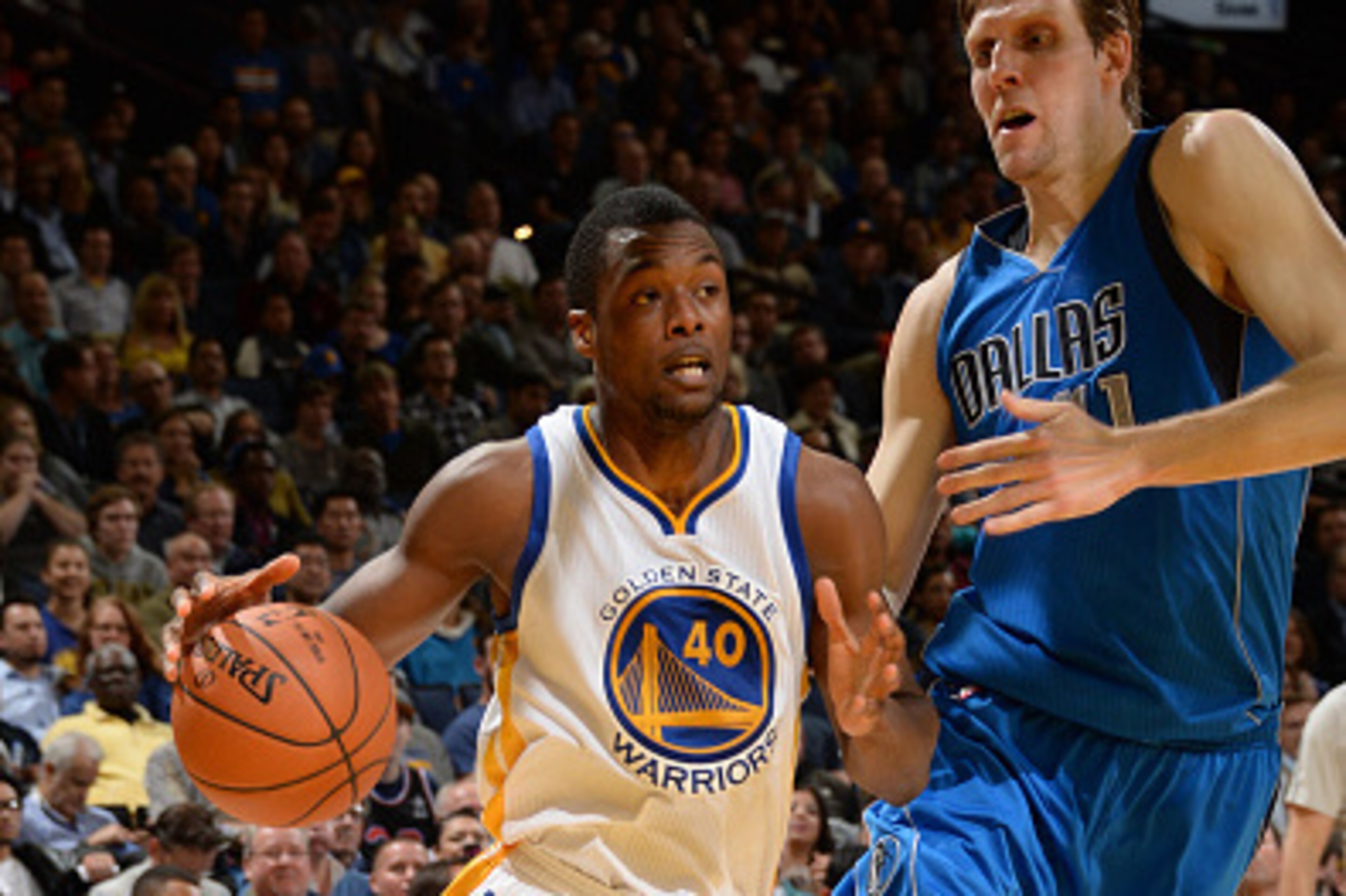 OAKLAND, CA - FEBRUARY 4: Harrison Barnes #40 of the Golden State Warriors drives to the basket against Dirk Nowitzki #41 of the Dallas Mavericks at Oracle Arena on February 4, 2015 in Oakland, California. NOTE TO USER: User expressly acknowledges and agr