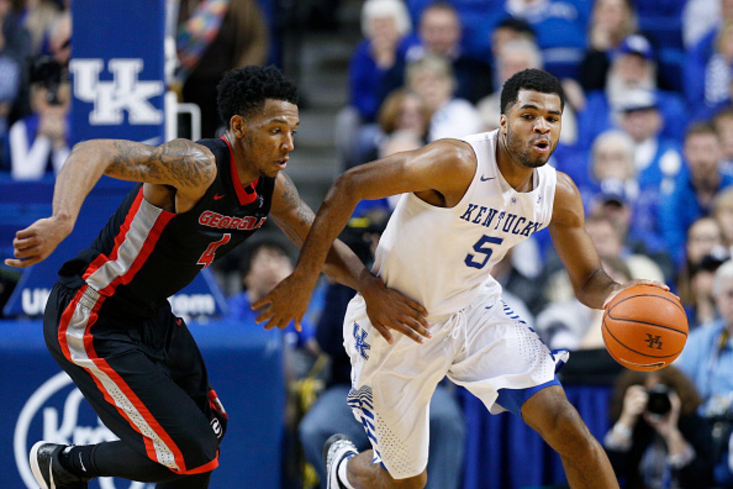 LEXINGTON, KY - FEBRUARY 3: Andrew Harrison #5 of the Kentucky Wildcats brings the ball up the floor against pressure from Charles Mann #4 of the Georgia Bulldogs during the game at Rupp Arena on February 3, 2015 in Lexington, Kentucky. Kentucky defeated 