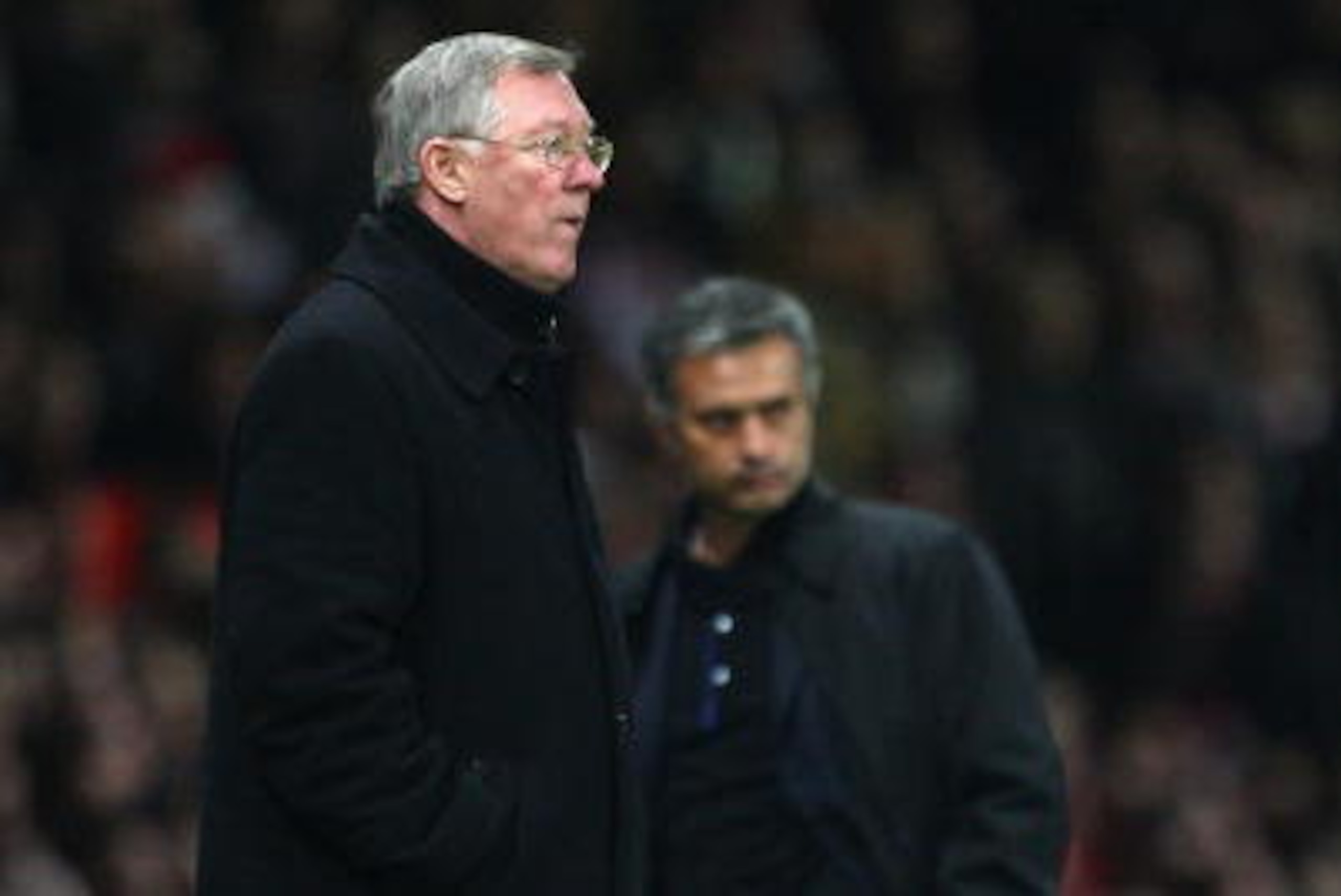 MANCHESTER, UNITED KINGDOM - MARCH 11:  Manchester United Manager Sir Alex Ferguson (L) and Inter Milan Manager Jose Mourinho watch the action during the UEFA Champions League Round of Sixteen, Second Leg match between Manchester United and Inter Milan at
