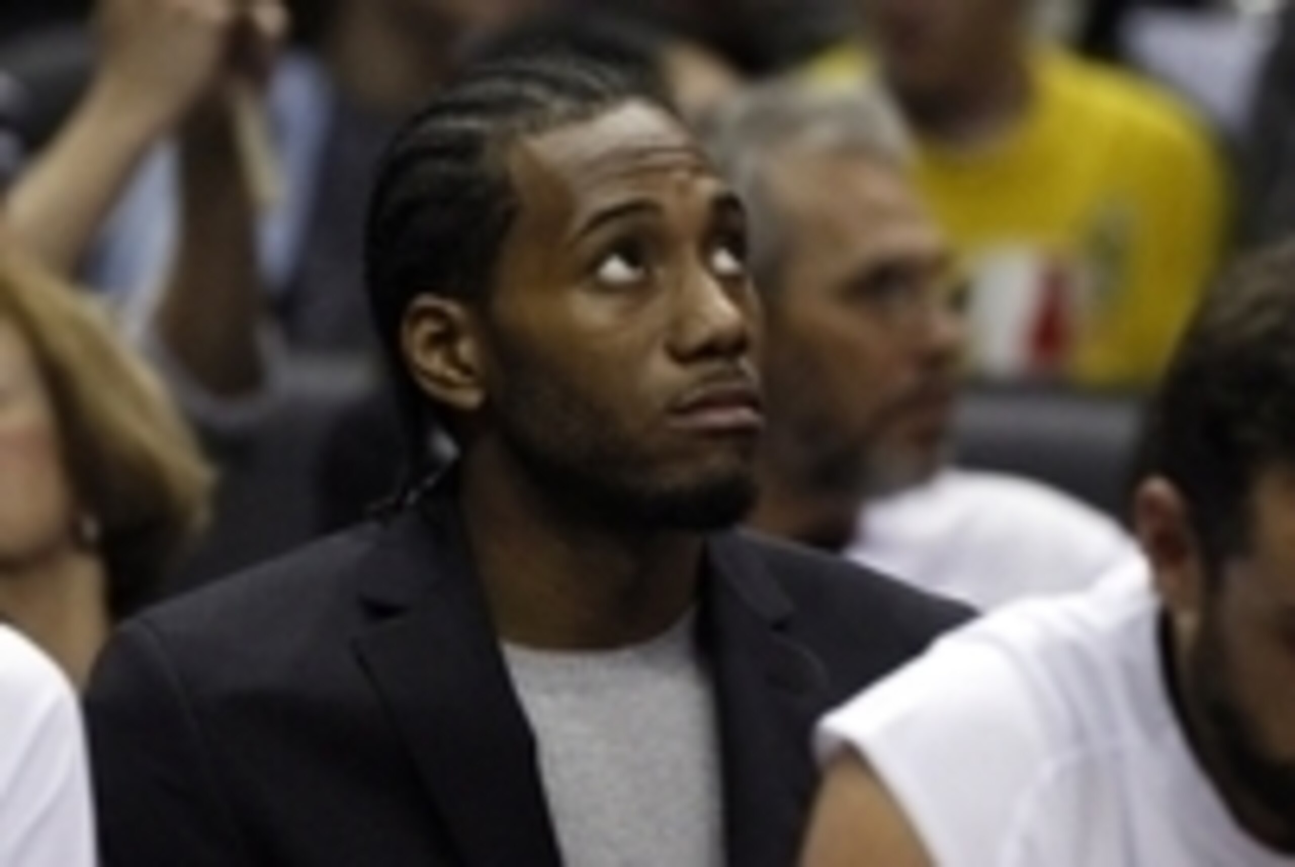 Dec 10, 2014; San Antonio, TX, USA; San Antonio Spurs small forward Kawhi Leonard (2) watches from the bench against the New York Knicks during the second half at AT&T Center. Mandatory Credit: Soobum Im-USA TODAY Sports