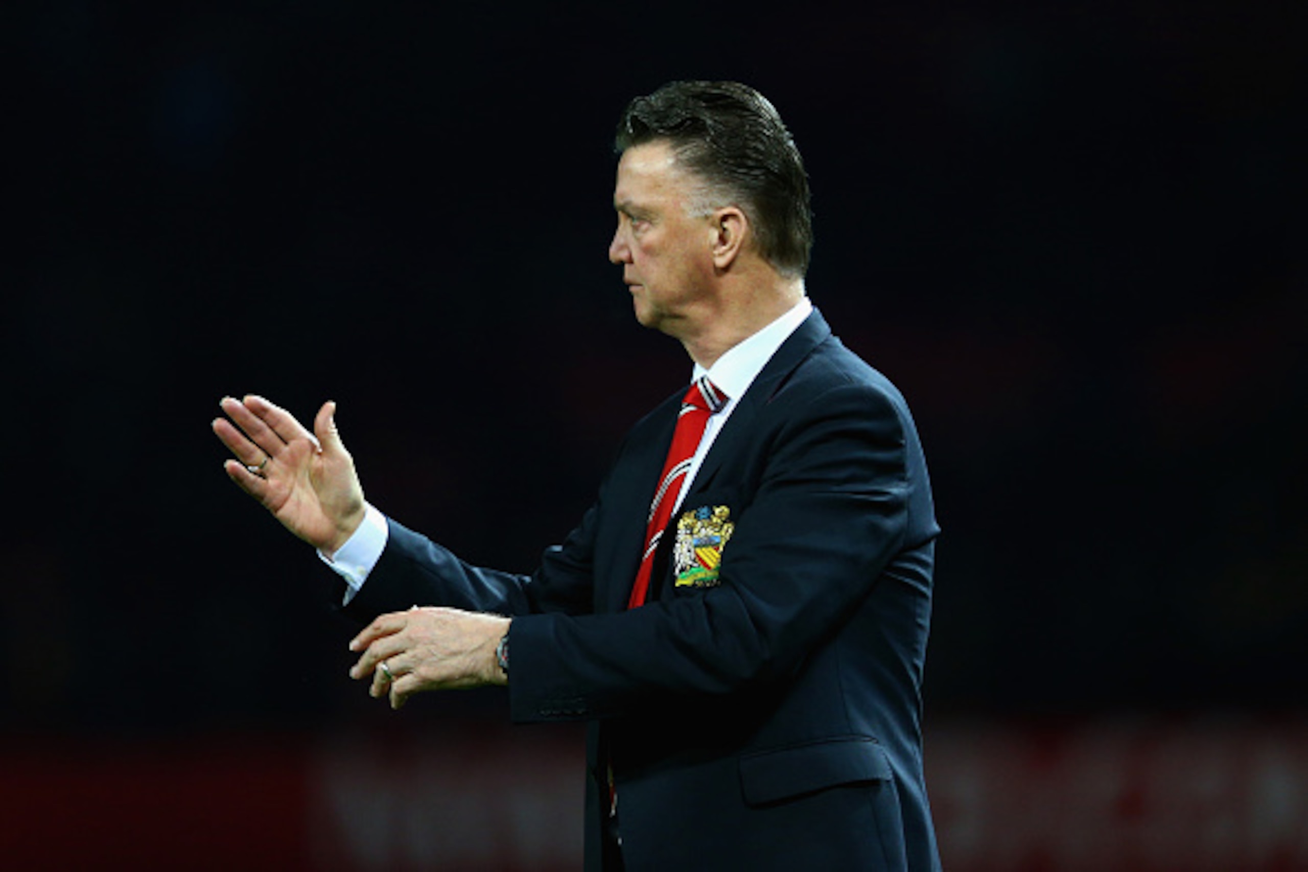 MANCHESTER, ENGLAND - FEBRUARY 03:  Manager Louis van Gaal of Manchester United gestures during the FA Cup Fourth round replay match between Manchester United and Cambridge United at Old Trafford on February 3, 2015 in Manchester, England.  (Photo by Cliv