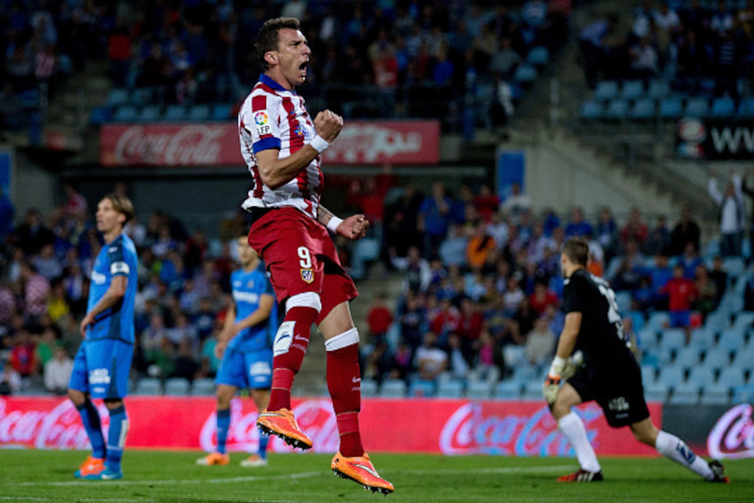 GETAFE, SPAIN - OCTOBER 26:  Mario Mandzukic of Atletico de Madrid celebrates scoring their opening goal during the La Liga match between Getafe CF and Club Atletico de Madrid at Coliseum Alfonso Perez on October 26, 2014 in Getafe, Spain.  (Photo by Gonz