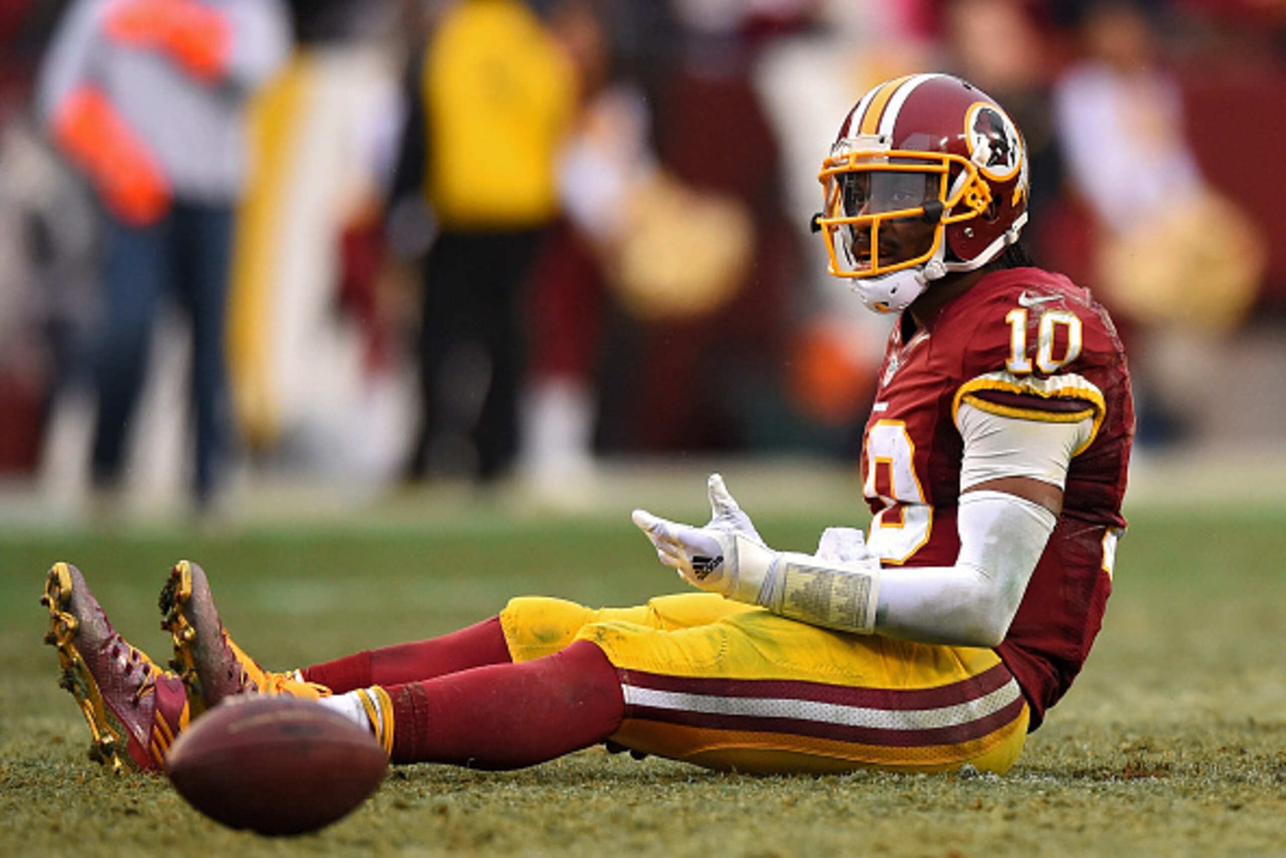 LANDOVER, MD - DECEMBER 28: Quarterback Robert Griffin III #10 of the Washington Redskins reacts after throwing a fourth quarter interception against the Dallas Cowboys at FedExField on December 28, 2014 in Landover, Maryland. The Dallas Cowboys won, 44-1
