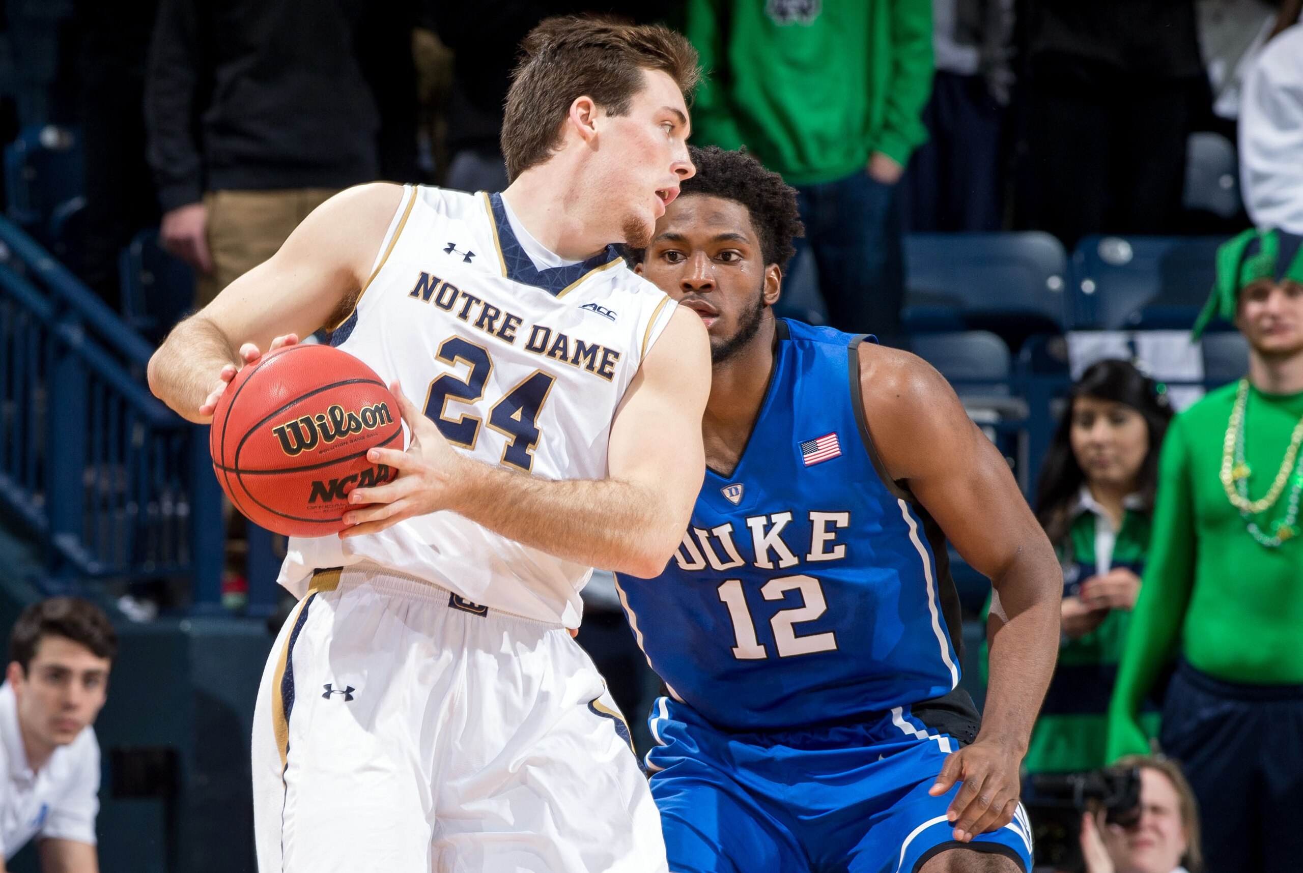 Jan 28, 2015; South Bend, IN, USA; Notre Dame Fighting Irish guard Pat Connaughton (24) dribbles as Duke Blue Devils forward Justise Winslow (12) defends in the first half at the Purcell Pavilion. Mandatory Credit: Matt Cashore-USA TODAY Sports