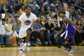 Nov 2, 2013; Oakland, CA, USA; Golden State Warriors point guard Toney Douglas (0) drives in against Sacramento Kings point guard Isaiah Thomas (22) during the third quarter at Oracle Arena. The Golden State Warriors defeated the Sacramento Kings 98-87. M