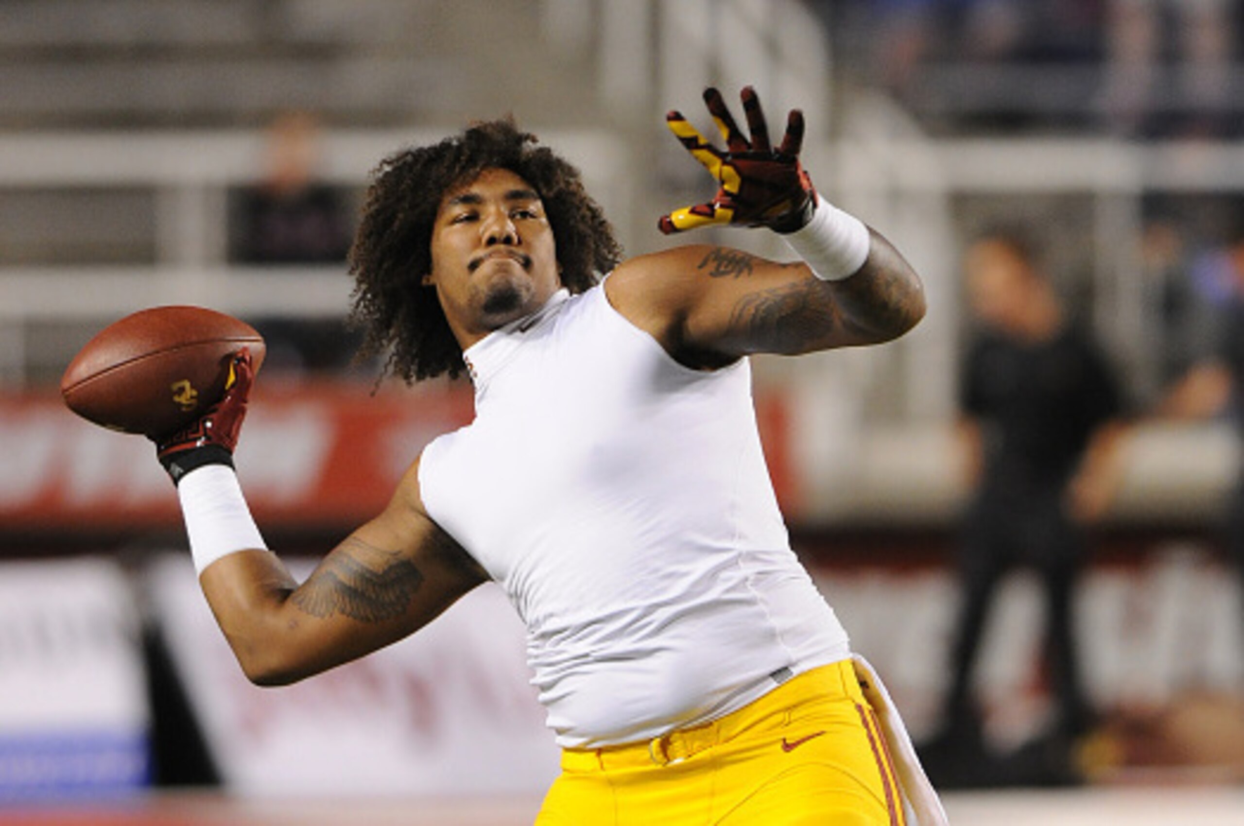 SALT LAKE CITY, UT - OCTOBER 25: Defensive end Leonard Williams #94 of the USC Trojans plays catch before their game against the Utah Utes at Rice-Eccles Stadium on October 25, 2014 in Salt Lake City, Utah. (Photo by Gene Sweeney Jr/Getty Images )