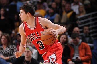 DENVER, CO - NOVEMBER 25:  Doug McDermott #3 of the Chicago Bulls drives to the basket against the Denver Nuggets on November 25, 2014 at the Pepsi Center in Denver, Colorado. NOTE TO USER: User expressly acknowledges and agrees that, by downloading and o