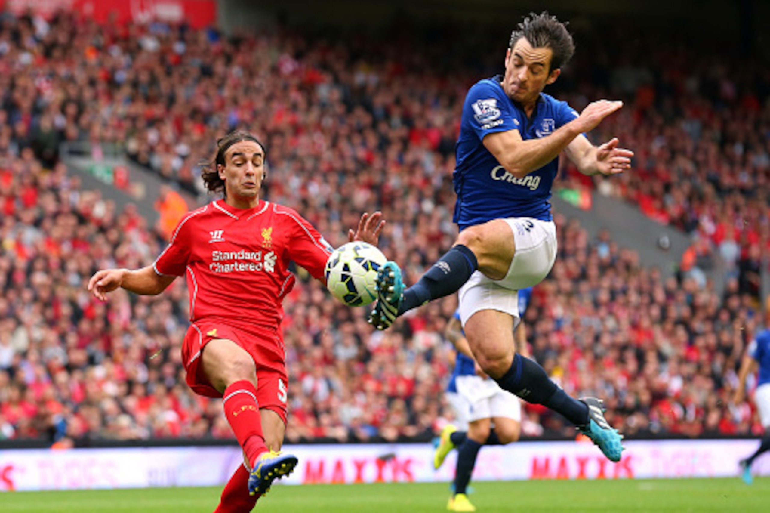 LIVERPOOL, ENGLAND - SEPTEMBER 27:  Leighton Baines of Everton tackles Lazar Markovic of Liverpool during the Barclays Premier League match between Liverpool and Everton at Anfield on September 27, 2014 in Liverpool, England.  (Photo by Alex Livesey/Getty