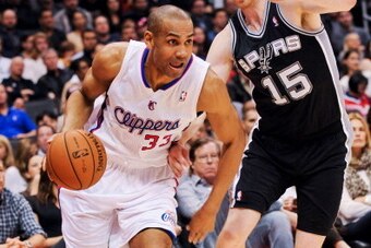 LOS ANGELES, CA - FEBRUARY 21: Grant Hill #33 of the Los Angeles Clippers drives along the baseline against Matt Bonner #15 of the San Antonio Spurs at Staples Center on February 21, 2013 in Los Angeles, California. NOTE TO USER: User expressly acknowledg