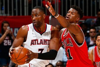 ATLANTA, GA - DECEMBER 15:  Jimmy Butler #21 of the Chicago Bulls against Elton Brand #7 of the Atlanta Hawks at Philips Arena on December 15, 2014 in Atlanta, Georgia.  NOTE TO USER: User expressly acknowledges and agrees that, by downloading and or usin