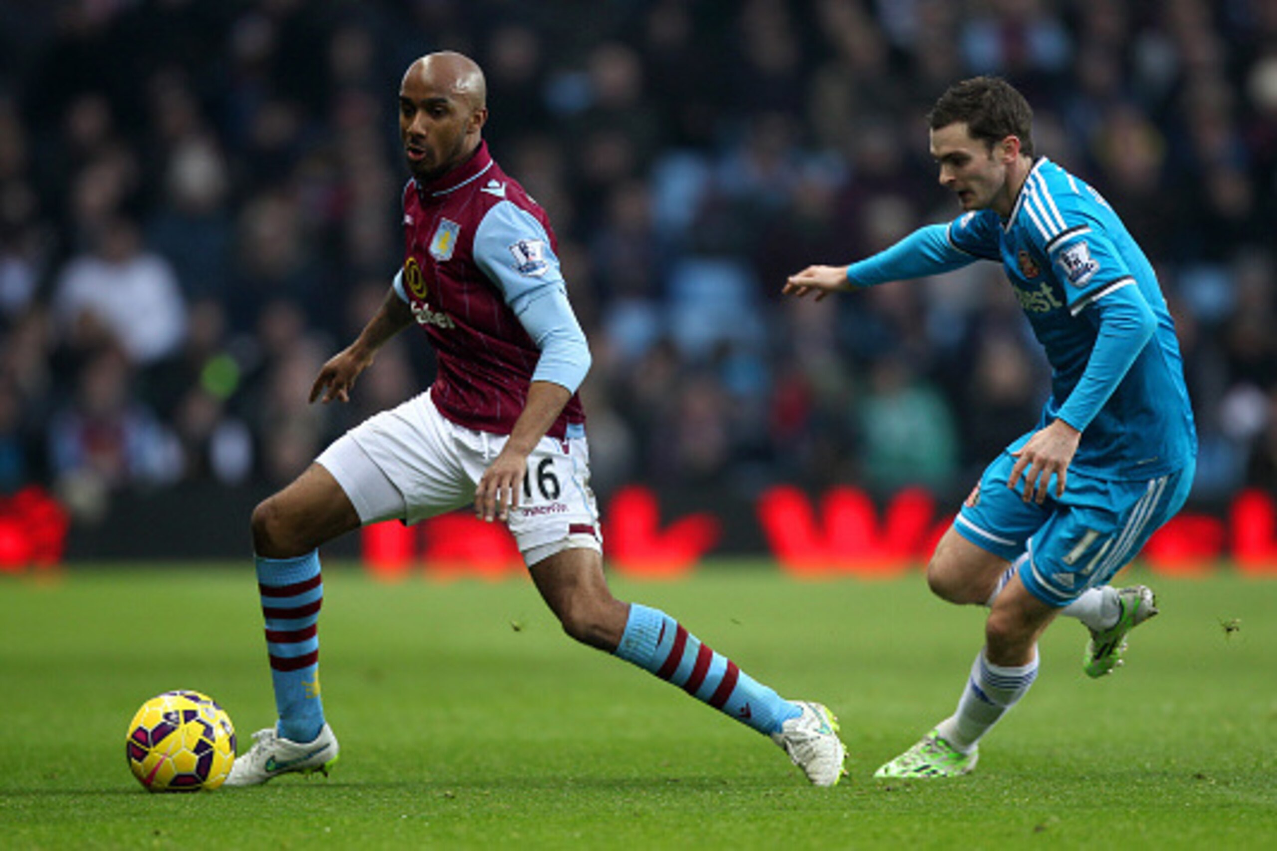 BIRMINGHAM, ENGLAND - DECEMBER 28:  Fabian Delph of Aston Villa runs with the ball past Adam Johnson of Sunderland during the Barclays Premier League match between Aston Villa and Sunderland at Villa Park on December 28, 2014 in Birmingham, England.  (Pho