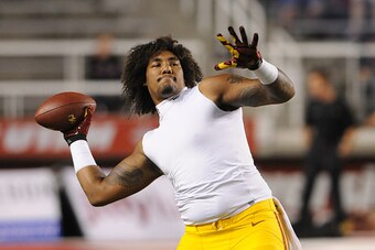SALT LAKE CITY, UT - OCTOBER 25: Defensive end Leonard Williams #94 of the USC Trojans plays catch before their game against the Utah Utes at Rice-Eccles Stadium on October 25, 2014 in Salt Lake City, Utah. (Photo by Gene Sweeney Jr/Getty Images )