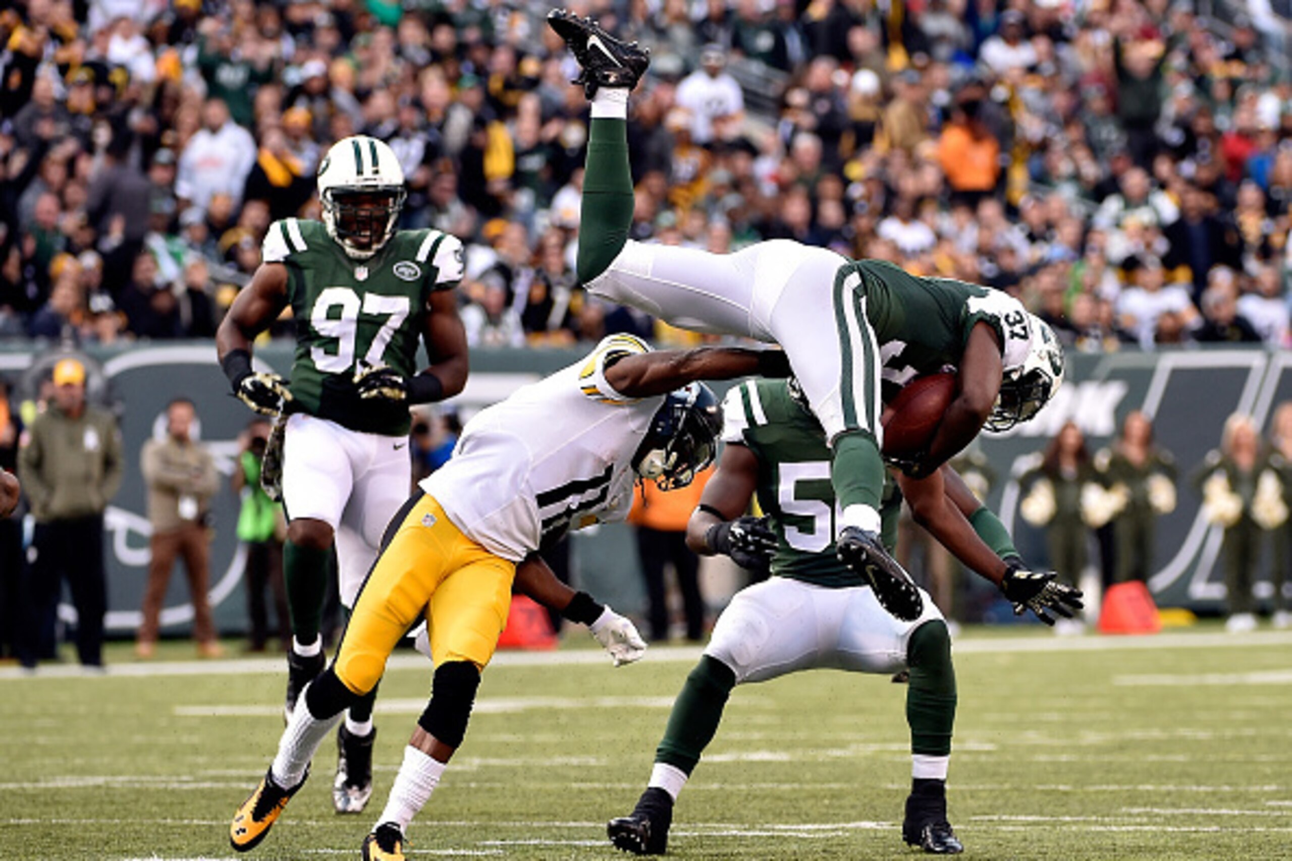 EAST RUTHERFORD, NJ - NOVEMBER 09:  Free safety Jaiquawn Jarrett #37 of the New York Jets intercepts a ball intended for wide receiver Markus Wheaton #11 of the Pittsburgh Steelers during a game at MetLife Stadium on November 9, 2014 in East Rutherford, N