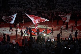 TORONTO, ON - MAY 4:  Mascot Raptor of the Toronto Raptors gets the crowd pumped up prior to Game Seven of the Eastern Conference Quarterfinals during the NBA Playoffs at the Air Canada Centre on May 4, 2014 in Toronto, Ontario, Canada. NOTE TO USER: User