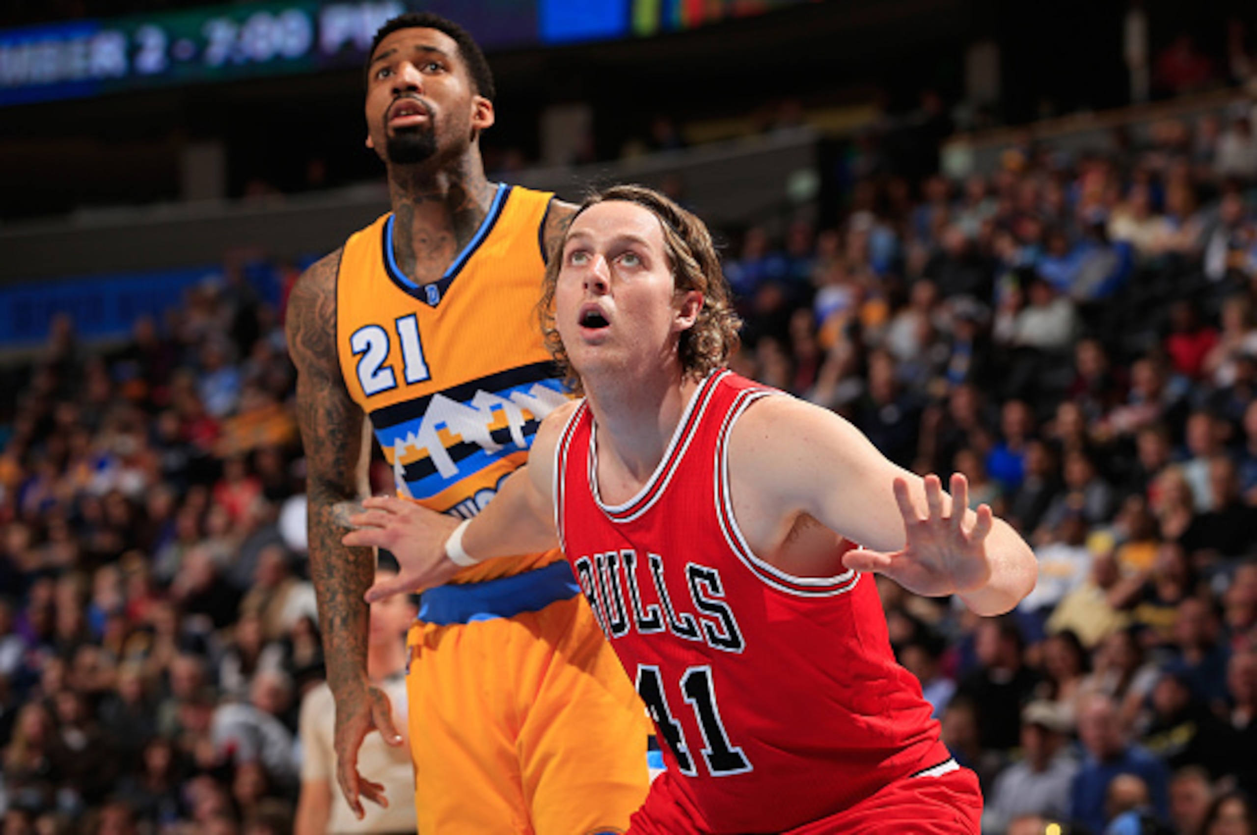 DENVER, CO - NOVEMBER 25:  Cameron Bairstow #41 of the Chicago Bulls battles for rebounding position against Wilson Chandler #21 of the Denver Nuggets at Pepsi Center on November 25, 2014 in Denver, Colorado. The Nuggets defeated the Bulls 114-109. NOTE T