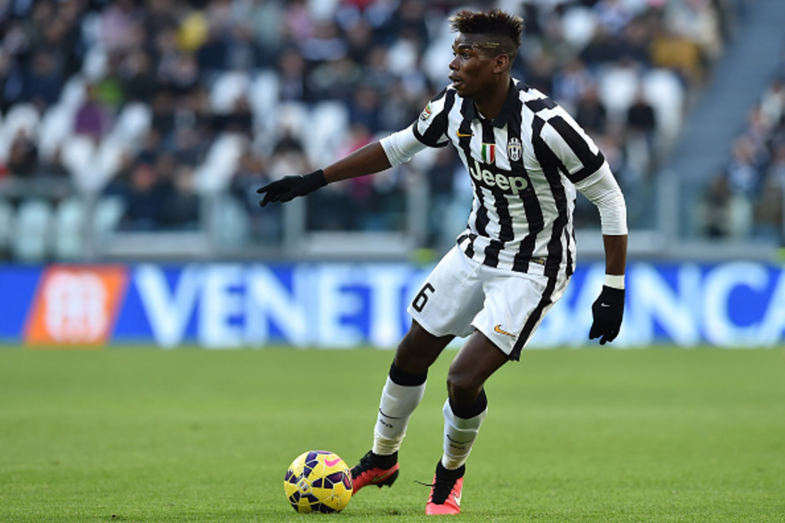 TURIN, ITALY - JANUARY 25:  Paul Pogba of Juventus FC in action during the Serie A match between Juventus FC and AC Chievo Verona at Juventus Arena on January 25, 2015 in Turin, Italy.  (Photo by Valerio Pennicino/Getty Images)