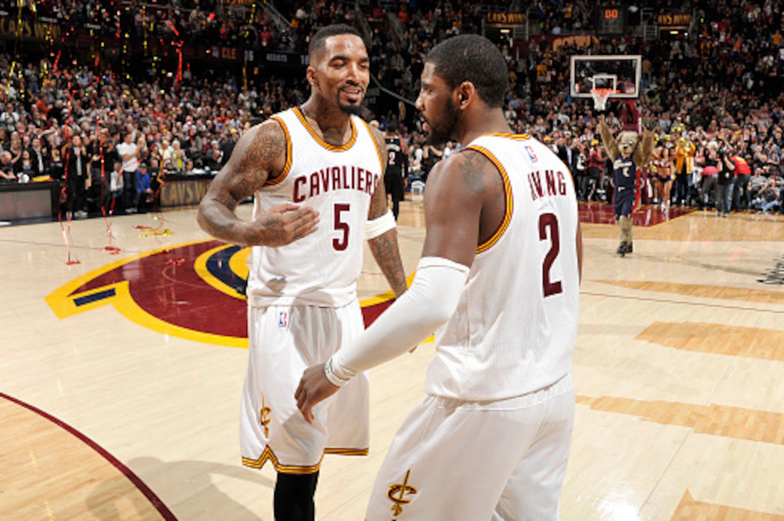 CLEVELAND, OH - JANUARY 28:  Kyrie Irving #2 and J.R. Smith #5 of the Cleveland Cavaliers celebrate a victory against the Portland Trail Blazers on January 28, 2015 at Quicken Loans Arena in Cleveland, Ohio. NOTE TO USER: User expressly acknowledges and a
