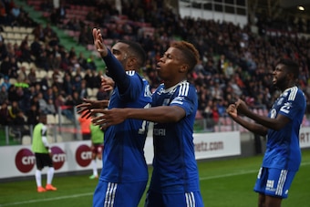 METZ, FRANCE - AUGUST 31:  Alexandre Lacazette (L) of Lyon celebrates scoring his team's first goal with his teammates Clinton N'Jie (C) and Arnold Mvuemba (R) during the French Ligue 1 match between FC Metz and Olympique Lyonnais at Stade Saint-Symphorie
