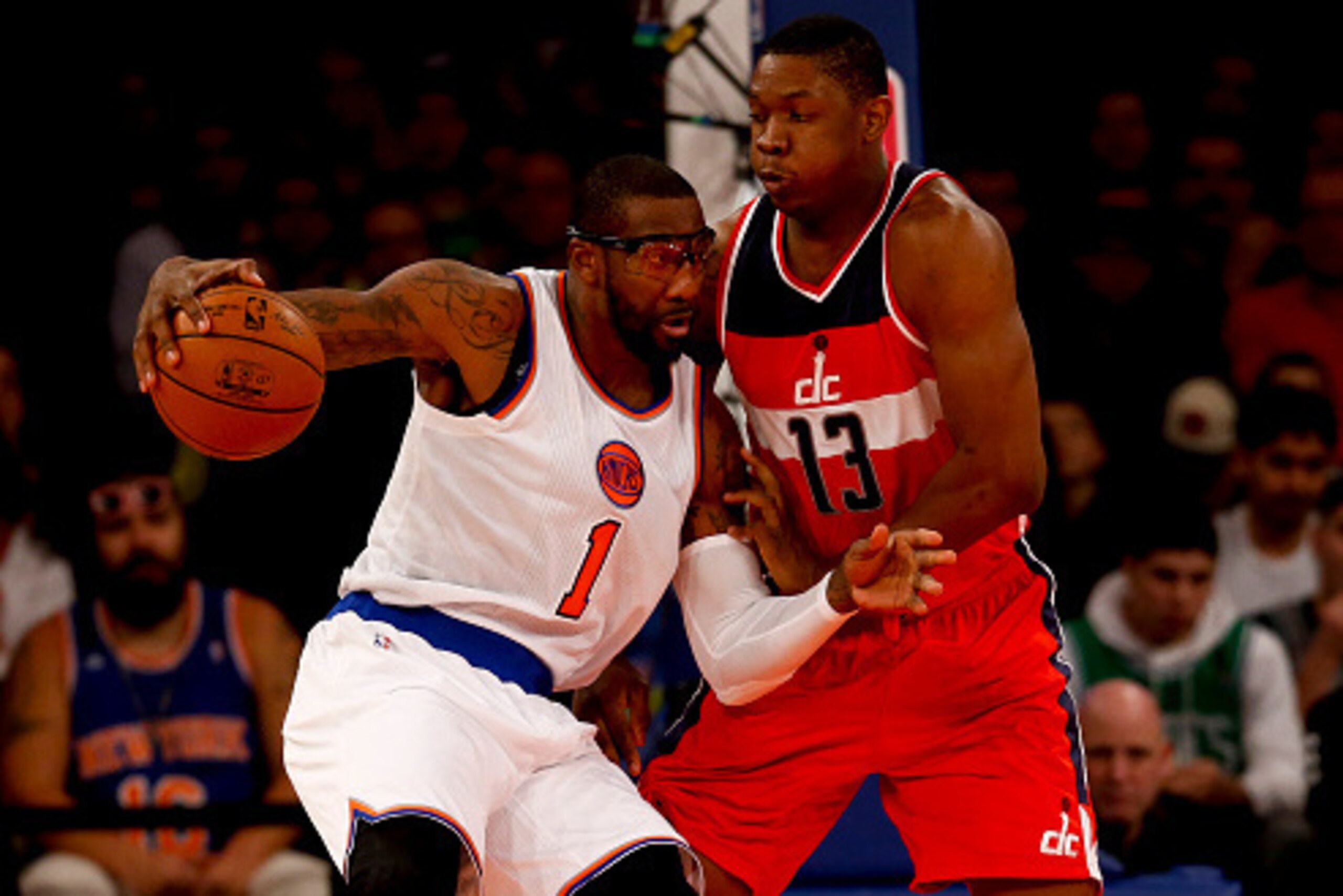 NEW YORK, NY - DECEMBER 25:  Kevin Seraphin #13 of the Washington Wizards guards Amar'e Stoudemire #1 of the New York Knicks  in the first half of their game at Madison Square Garden on December 25, 2014 in New York City.  NOTE TO USER: User expressly ack
