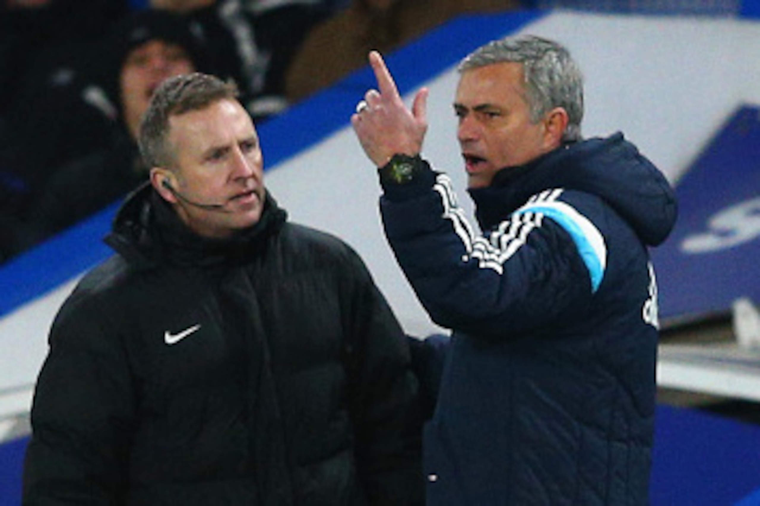 LONDON, ENGLAND - JANUARY 31: Jose Mourinho manager of Chelsea speaks to Fourth Official Jonathan Moss during the Barclays Premier League match between Chelsea and Manchester City at Stamford Bridge on January 31, 2015 in London, England.  (Photo by Clive