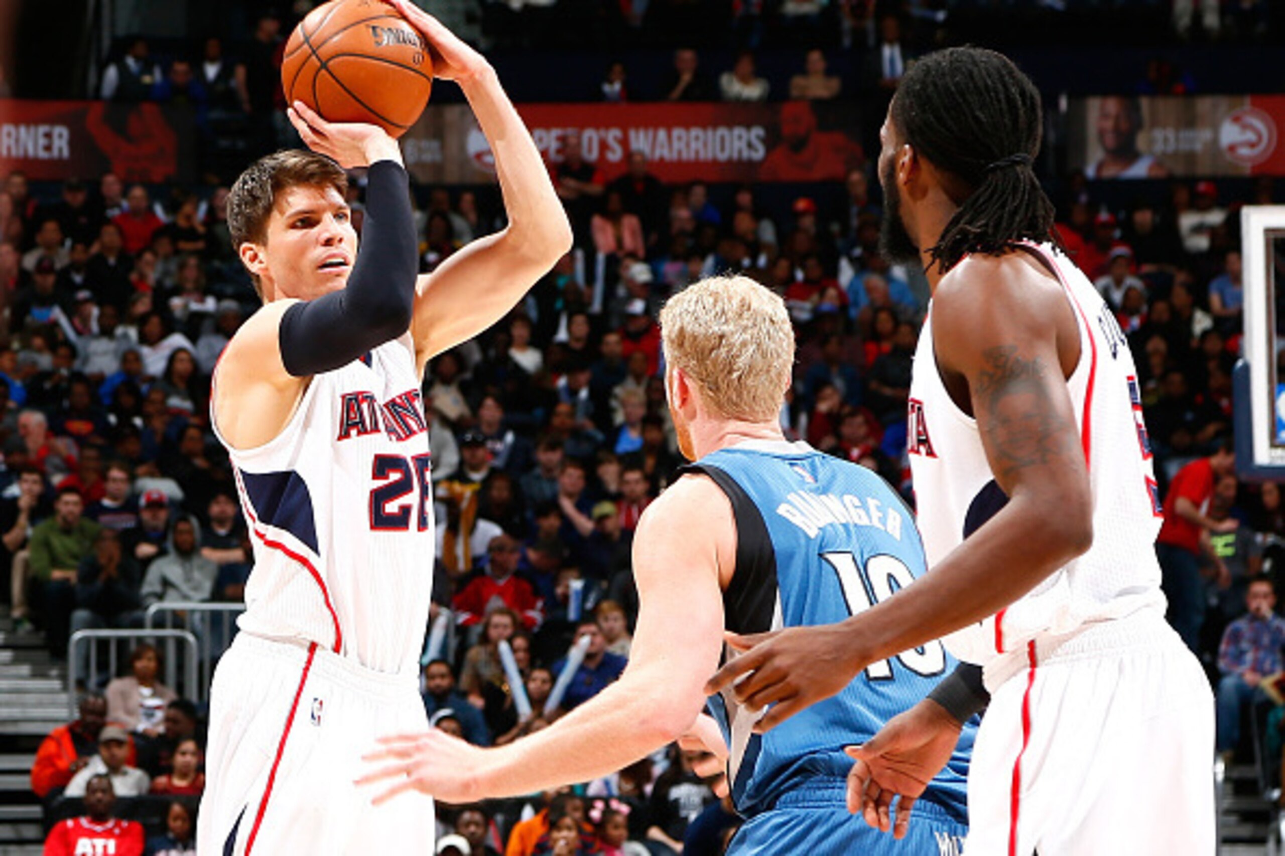 ATLANTA, GA - JANUARY 25:  Kyle Korver #26 of the Atlanta Hawks against Chase Budinger #10 of the Minnesota Timberwolves at Philips Arena on January 25, 2015 in Atlanta, Georgia.  NOTE TO USER: User expressly acknowledges and agrees that, by downloading a