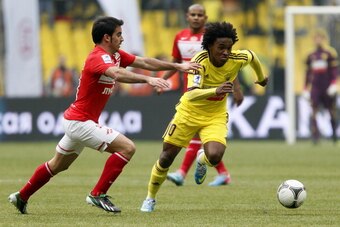 MOSCOW, RUSSIA - APRIL 28: Jose Manuel Jurado (L) of FC Spartak Moscow is challenged by Willian of FC Anzhi Makhachkala during the Russian Premier League match between FC Spartak Moscow and FC Anzhi Makhachkala at the Luzhniki Stadium on April 28, 2013 in