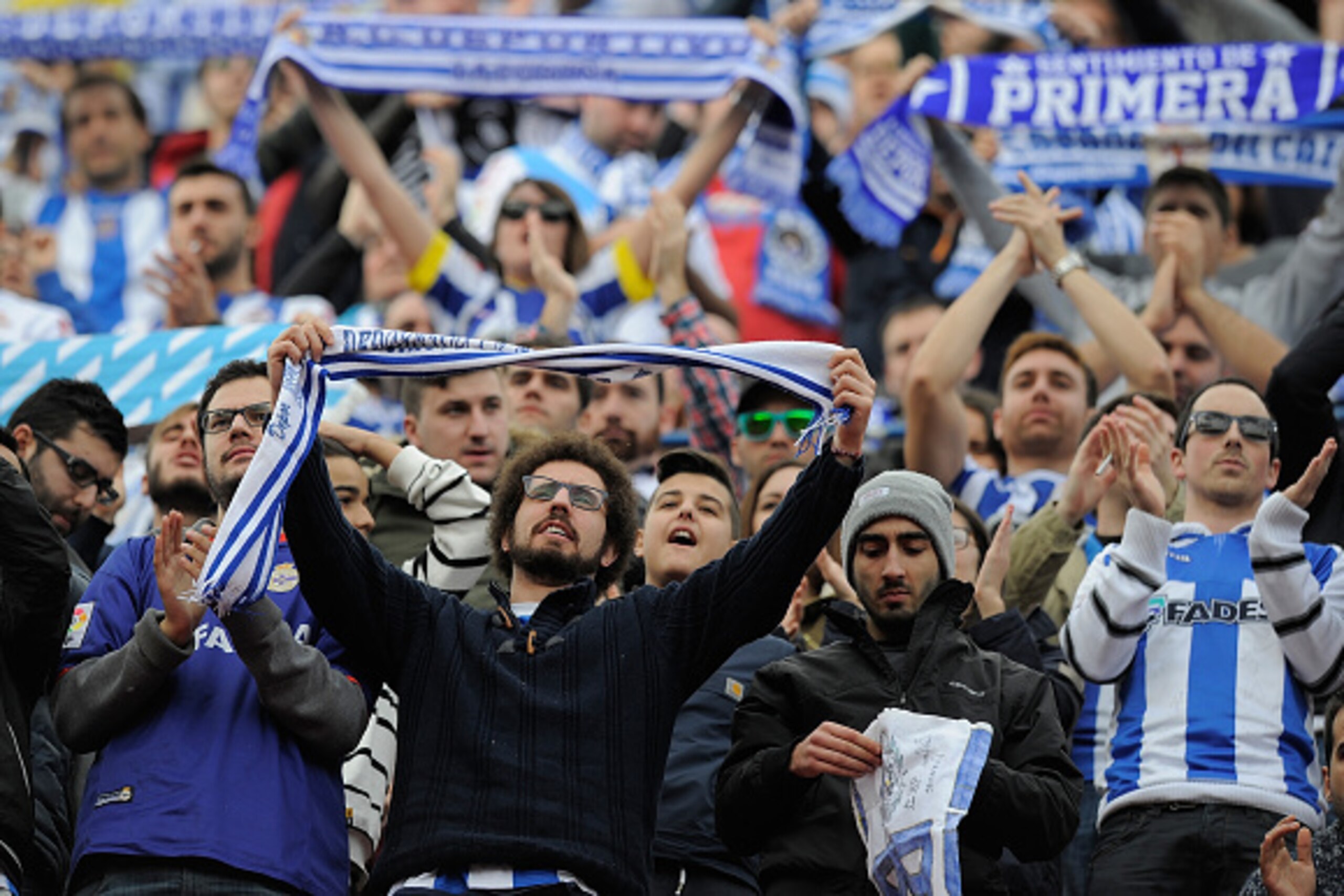 MADRID, SPAIN - NOVEMBER 30: RC Deportivo La Coruna fans cheers their team during the La Liga match between Club Atletico de Madrid and RC Deportivo La Coruna at Vicente Calderon Stadium on November 30, 2014 in Madrid, Spain. An RC Deportivo La Coruna MADRID, SPAIN - NOVEMBER 30: RC Deportivo La Coruna fans cheers their team during the La Liga match between Club Atletico de Madrid and RC Deportivo La Coruna at Vicente Calderon Stadium on November 30, 2014 in Madrid, Spain. An RC Deportivo La Coruna