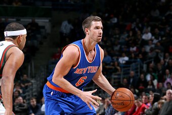 MILWAUKEE, WI - NOVEMBER 18: Travis Wear #6 of the New York Knicks handles the ball against the Milwaukee Bucks on November 18, 2014 at the BMO Harris Bradley Center in Milwaukee, Wisconsin. NOTE TO USER: User expressly acknowledges and agrees that, by do