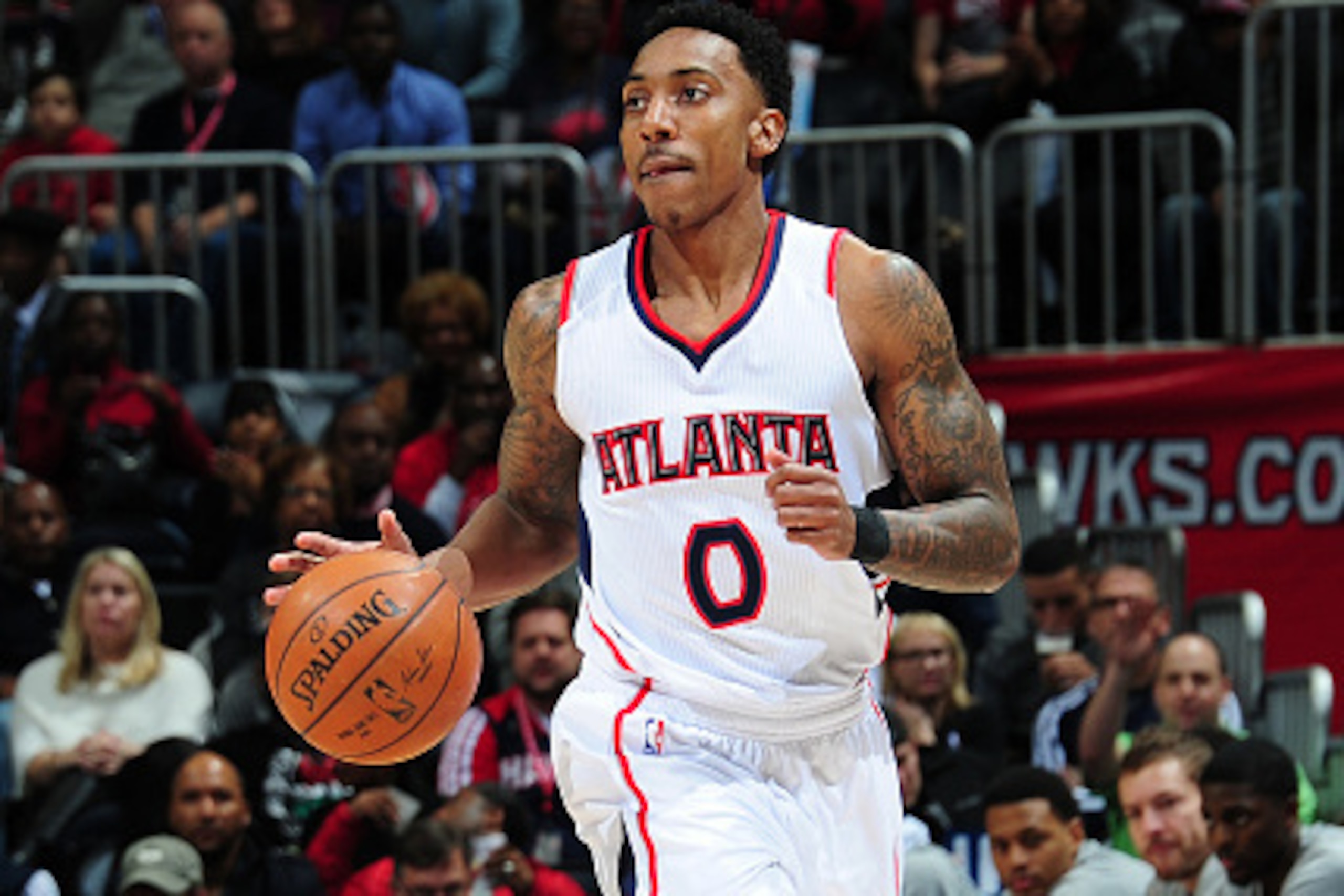ATLANTA, GA - FEBRUARY 6: Jeff Teague #0 of the Atlanta Hawks drives against the Golden State Warriors on February 6, 2015 at Philips Arena in Atlanta, Georgia.  NOTE TO USER: User expressly acknowledges and agrees that, by downloading and/or using this P