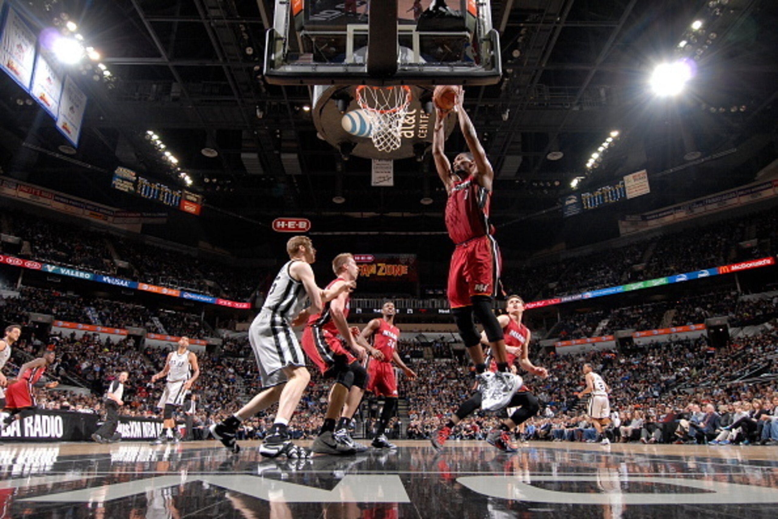 SAN ANTONIO, TX - FEBRUARY 6:  Chris Bosh #1 of the Miami Heat grabs the rebound against the San Antonio Spurs on February 6, 2015 at the AT&T Center in San Antonio, Texas. NOTE TO USER: User expressly acknowledges and agrees that, by downloading and or u