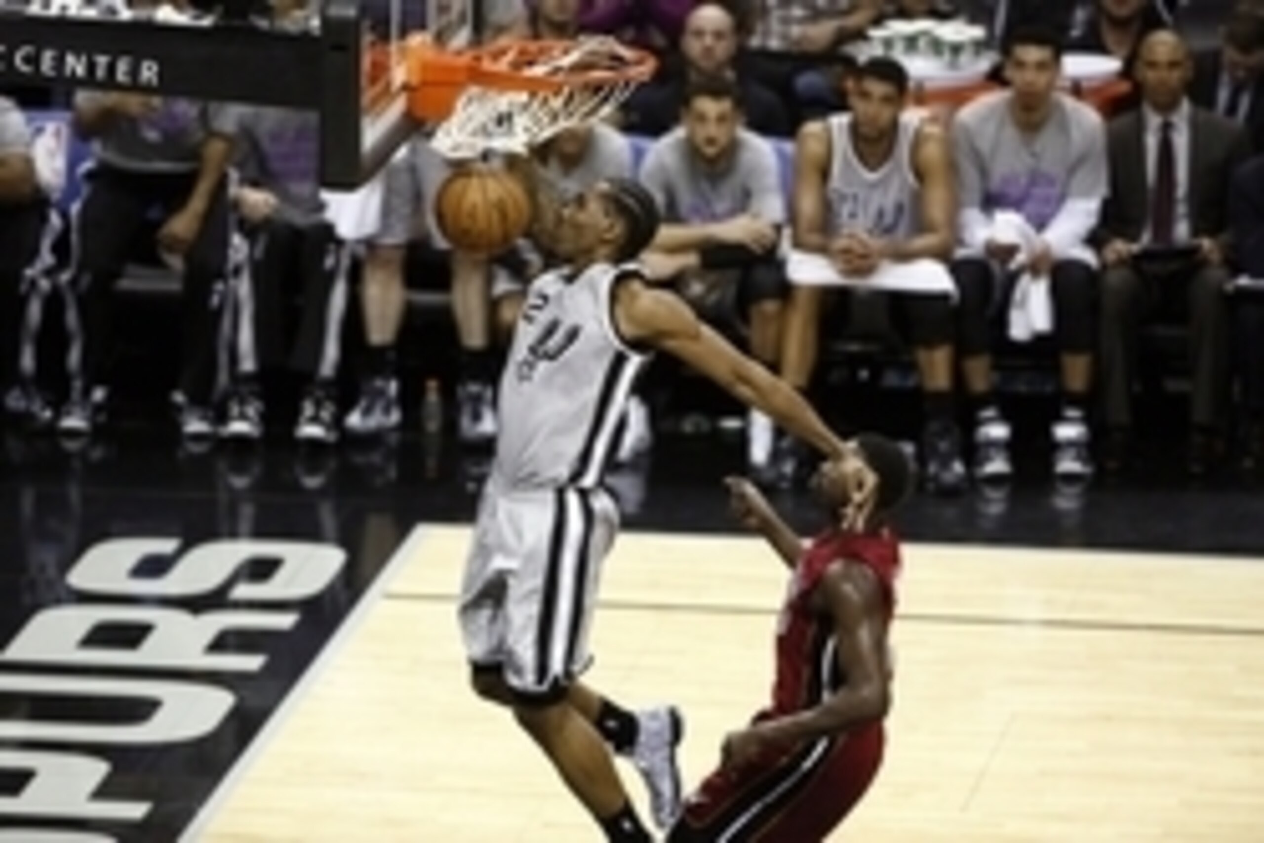 Feb 6, 2015; San Antonio, TX, USA; San Antonio Spurs small forward Kawhi Leonard (2) dunks the ball past Miami Heat small forward Luol Deng (R) during the first half at AT&T Center. Mandatory Credit: Soobum Im-USA TODAY Sports