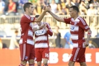 Jun 29, 2013; Philadelphia, PA, USA; FC Dallas forward Blas Perez (7), right and defender Matt Hedges (24) celebrate after tie against the Philadelphia Union at PPL Park. The Union and FC Dallas played to a 2-2 tie. Mandatory Credit: Eric Hartline-USA TOD