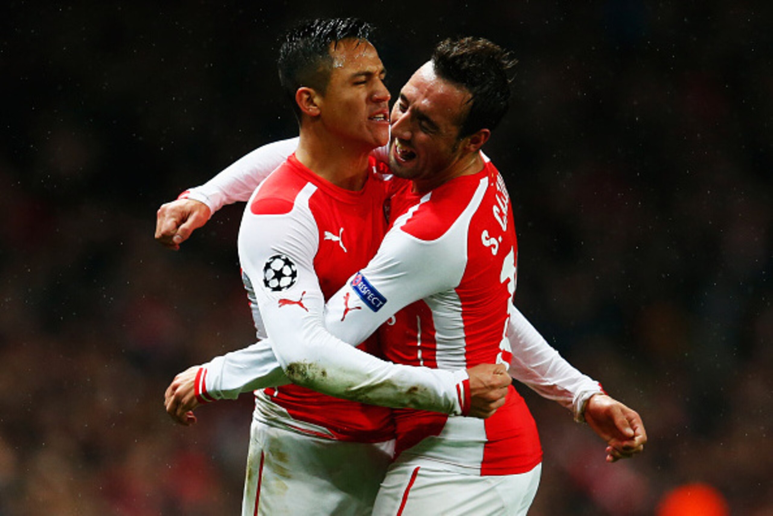 LONDON, ENGLAND - NOVEMBER 04:  Alexis Sanchez of Arsenal (L) celebrates with Santi Cazorla (R) as he scores their second goal during the UEFA Champions League Group D match between Arsenal FC and RSC Anderlecht at Emirates Stadium on November 4, 2014 in 