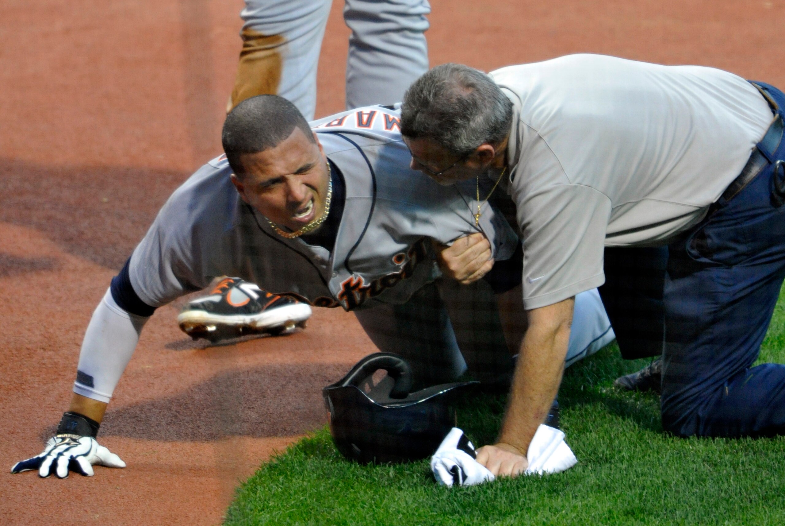 Aug 6, 2013; Cleveland, OH, USA; Detroit Tigers designated hitter Victor Martinez (41) reacts after being hit in the foot by Cleveland Indians starting pitcher Justin Masterson (not pictured) in the fifth inning against the Cleveland Indians at Progressiv