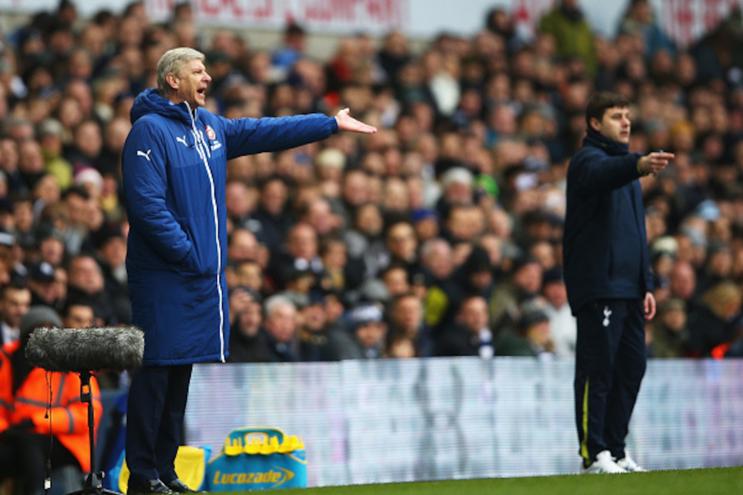 LONDON, ENGLAND - FEBRUARY 07:  Arsene Wenger, manager of Arsenal gestures with Mauricio Pochettino, manager of Tottenham Hotspur during the Barclays Premier League match between Tottenham Hotspur and Arsenal at White Hart Lane on February 7, 2015 in Lond