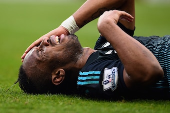 BIRMINGHAM, ENGLAND - FEBRUARY 07:  Didier Drogba of Chelsea grimaces as he lies on the turf during the Barclays Premier League match between Aston Villa and Chelsea at Villa Park on February 7, 2015 in Birmingham, England.  (Photo by Laurence Griffiths/G