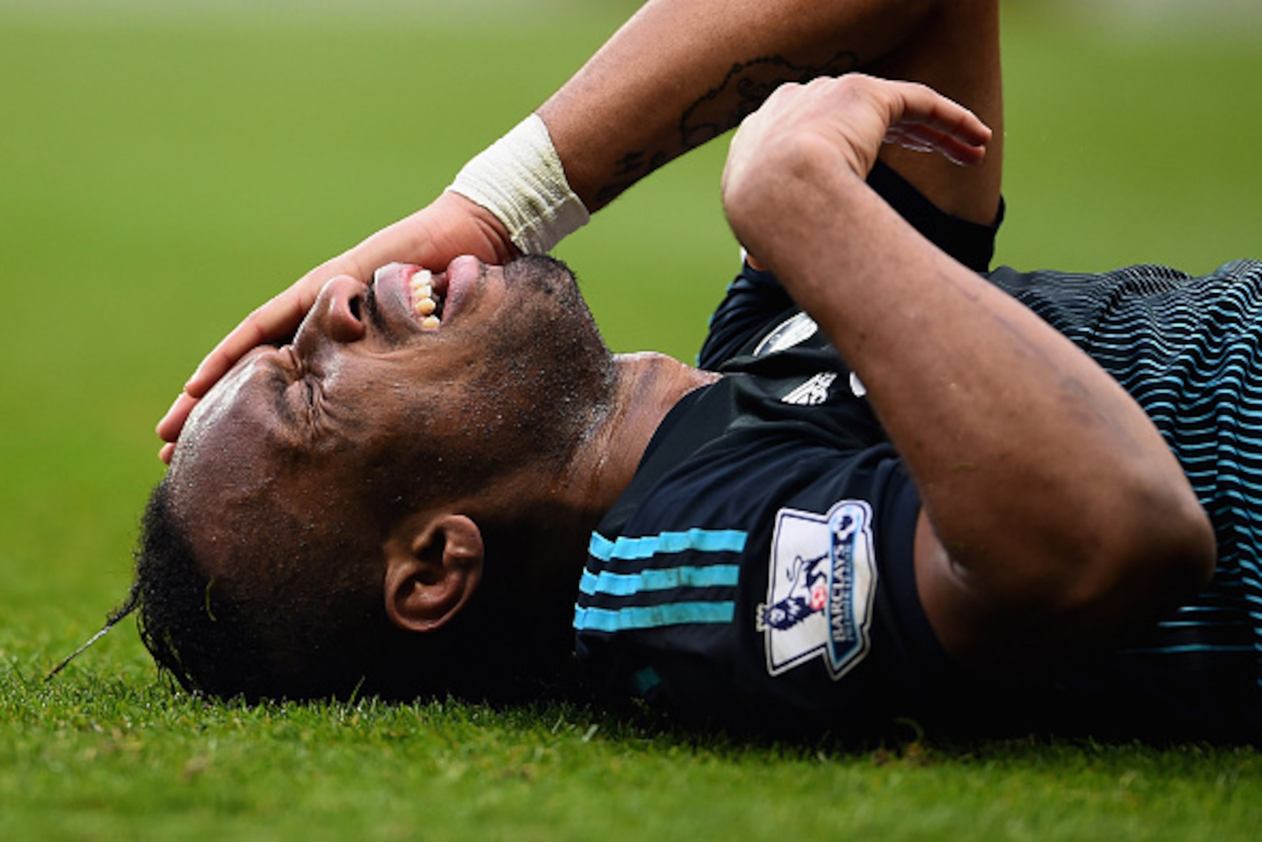 BIRMINGHAM, ENGLAND - FEBRUARY 07:  Didier Drogba of Chelsea grimaces as he lies on the turf during the Barclays Premier League match between Aston Villa and Chelsea at Villa Park on February 7, 2015 in Birmingham, England.  (Photo by Laurence Griffiths/G