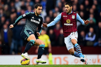 BIRMINGHAM, ENGLAND - FEBRUARY 07:  Eden Hazard of Chelsea battles for the ball with Carles Gil of Aston Villa during the Barclays Premier League match between Aston Villa and Chelsea at Villa Park on February 7, 2015 in Birmingham, England.  (Photo by La