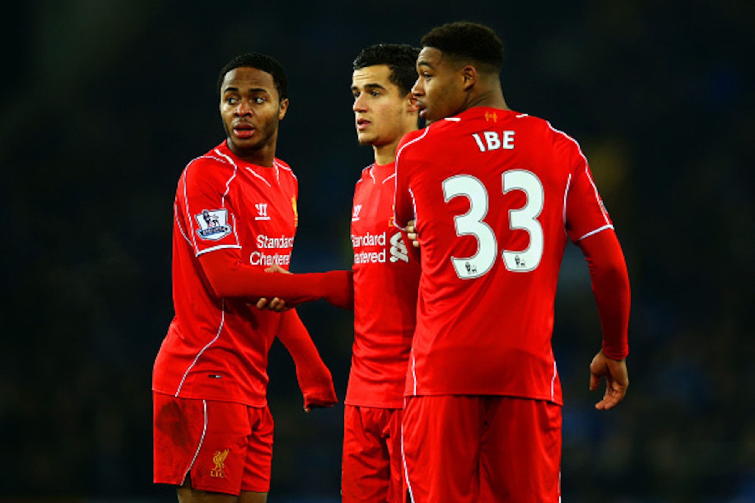 LIVERPOOL, ENGLAND - FEBRUARY 07:  (L-R) Raheem Sterling, Philippe Coutinho and Jordon Ibe of Liverpool line up a wall during the Barclays Premier League match between Everton and Liverpool at Goodison Park on February 7, 2015 in Liverpool, England.  (Pho