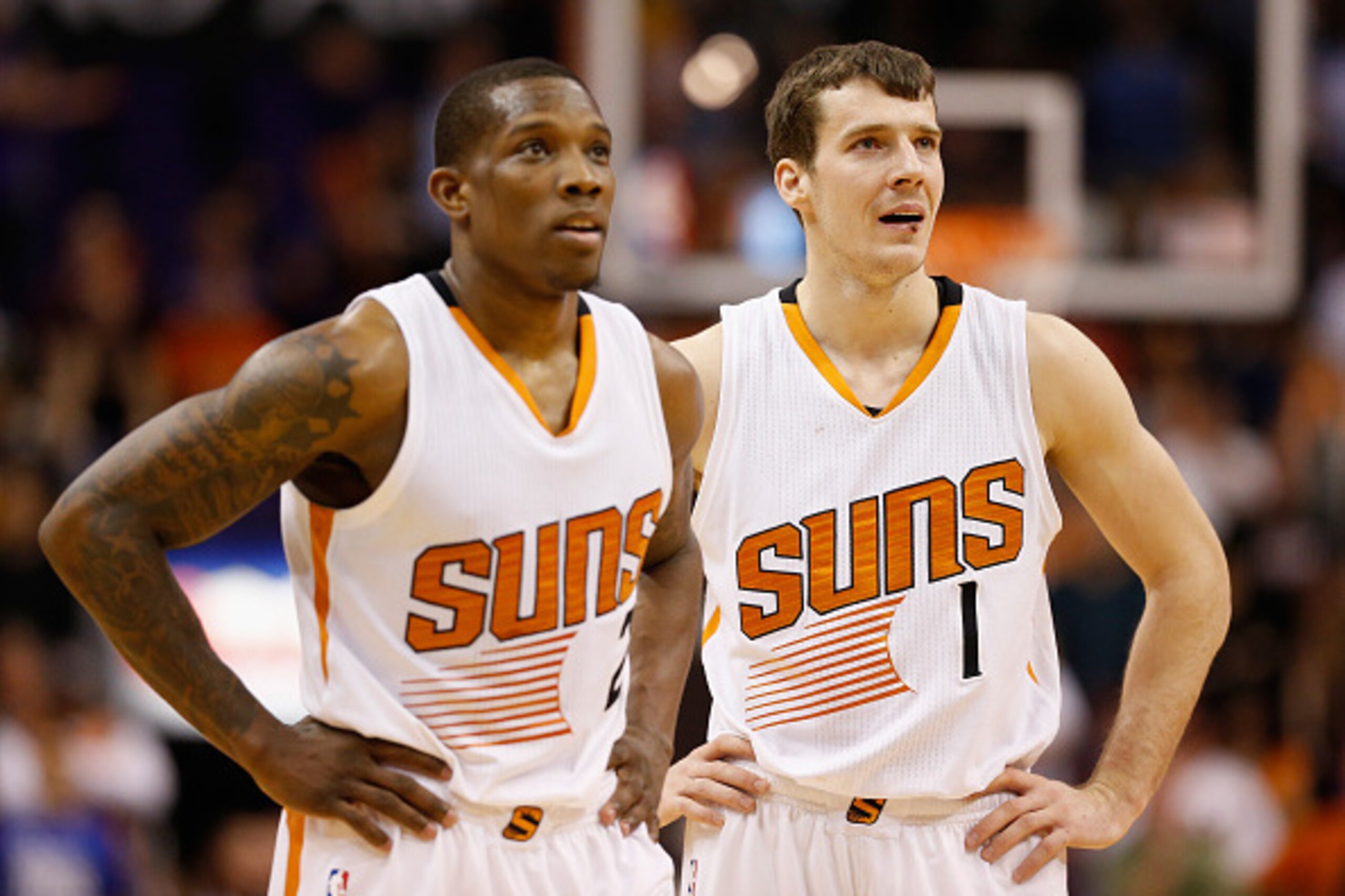 PHOENIX, AZ - JANUARY 21:  (R-L) Goran Dragic #1, and Eric Bledsoe #2 of the Phoenix Suns look on during a break from the NBA game against the Portland Trail Blazers at US Airways Center on January 21, 2015 in Phoenix, Arizona. The Suns defeated the Trail