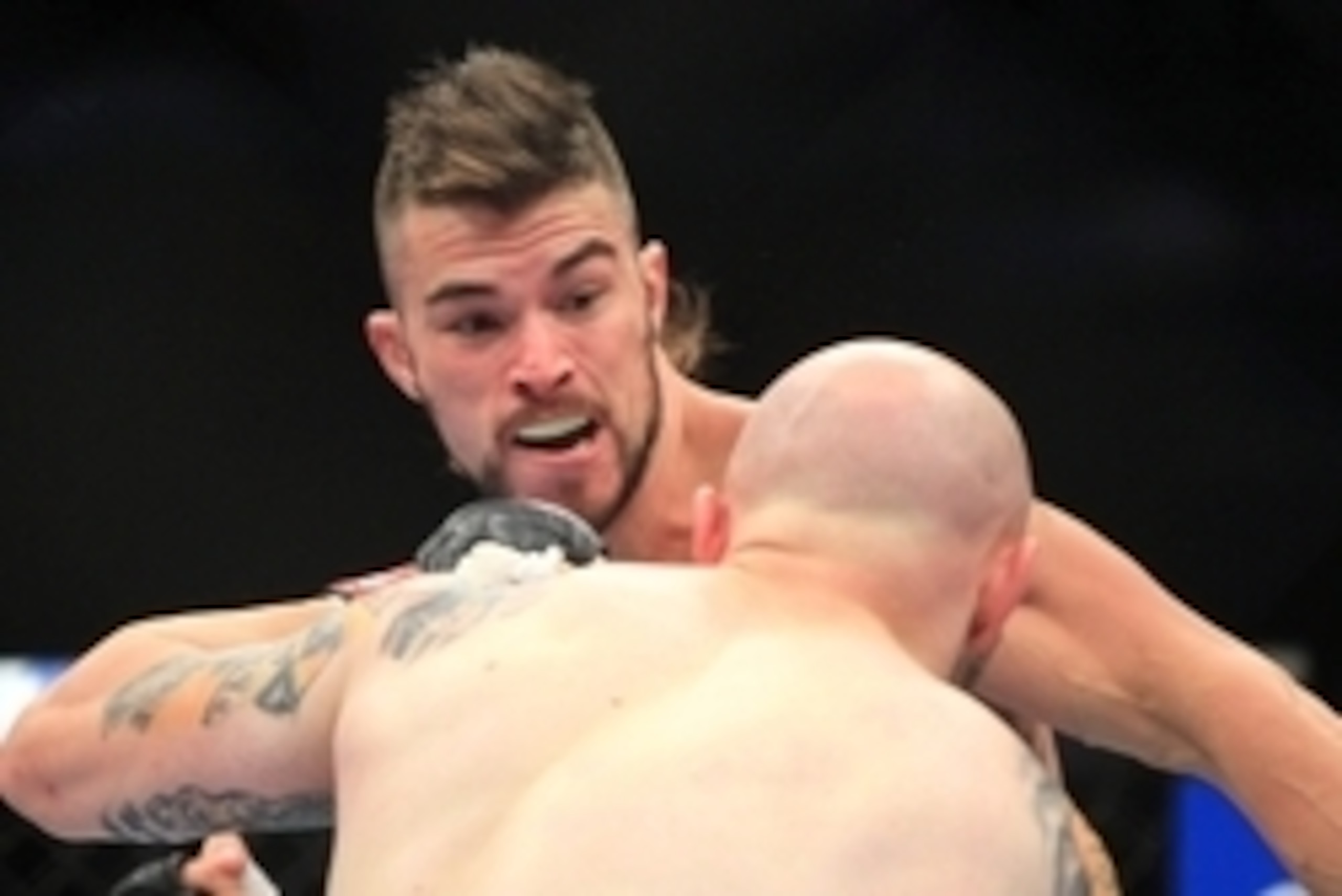 Aug 27, 2013; Indianapolis, IN, USA; Justin Edwards (front) fights Brandon Thatch during UFC Fight Night 27 at Bankers Life Fieldhouse. Mandatory Credit: Pat Lovell-USA TODAY Sports