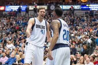 Feb 7, 2015; Dallas, TX, USA; Dallas Mavericks forward Dirk Nowitzki (41) congratulates guard Devin Harris (20) during the first half against the Portland Trail Blazers at the American Airlines Center. Mandatory Credit: Jerome Miron-USA TODAY Sports
