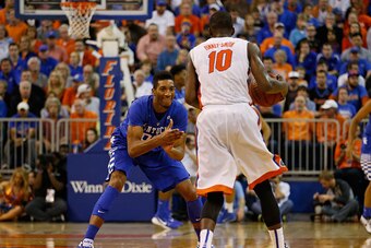 GAINESVILLE, FL - FEBRUARY 07: Marcus Lee #00 of the Kentucky Wildcats defends Dorian Finney-Smith #10 of the Florida Gators during the second half of the game at the Stephen C. O'Connell Center on February 7, 2015 in Gainesville, Florida.  (Photo by Rob 