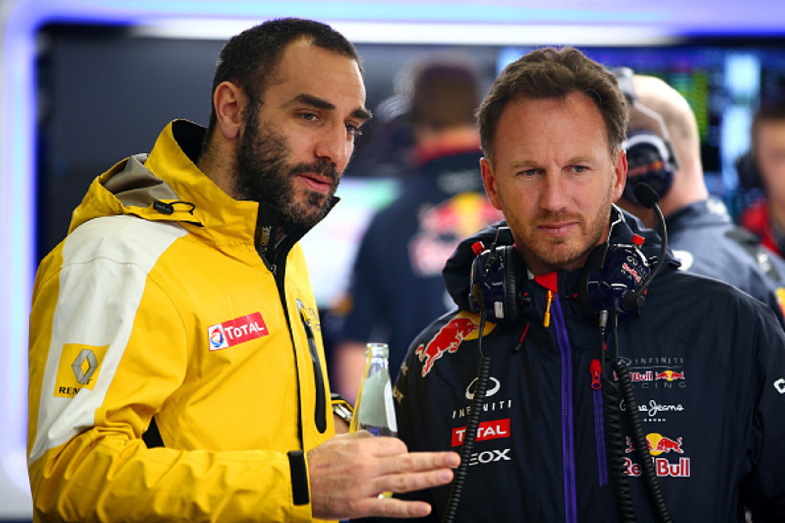 JEREZ DE LA FRONTERA, SPAIN - FEBRUARY 03:  Infiniti Red Bull Racing Team Principal Christian Horner speaks with Renault's Cyril Abiteboul in the garage during day three of Formula One Winter Testing at Circuito de Jerez on February 3, 2015 in Jerez de la