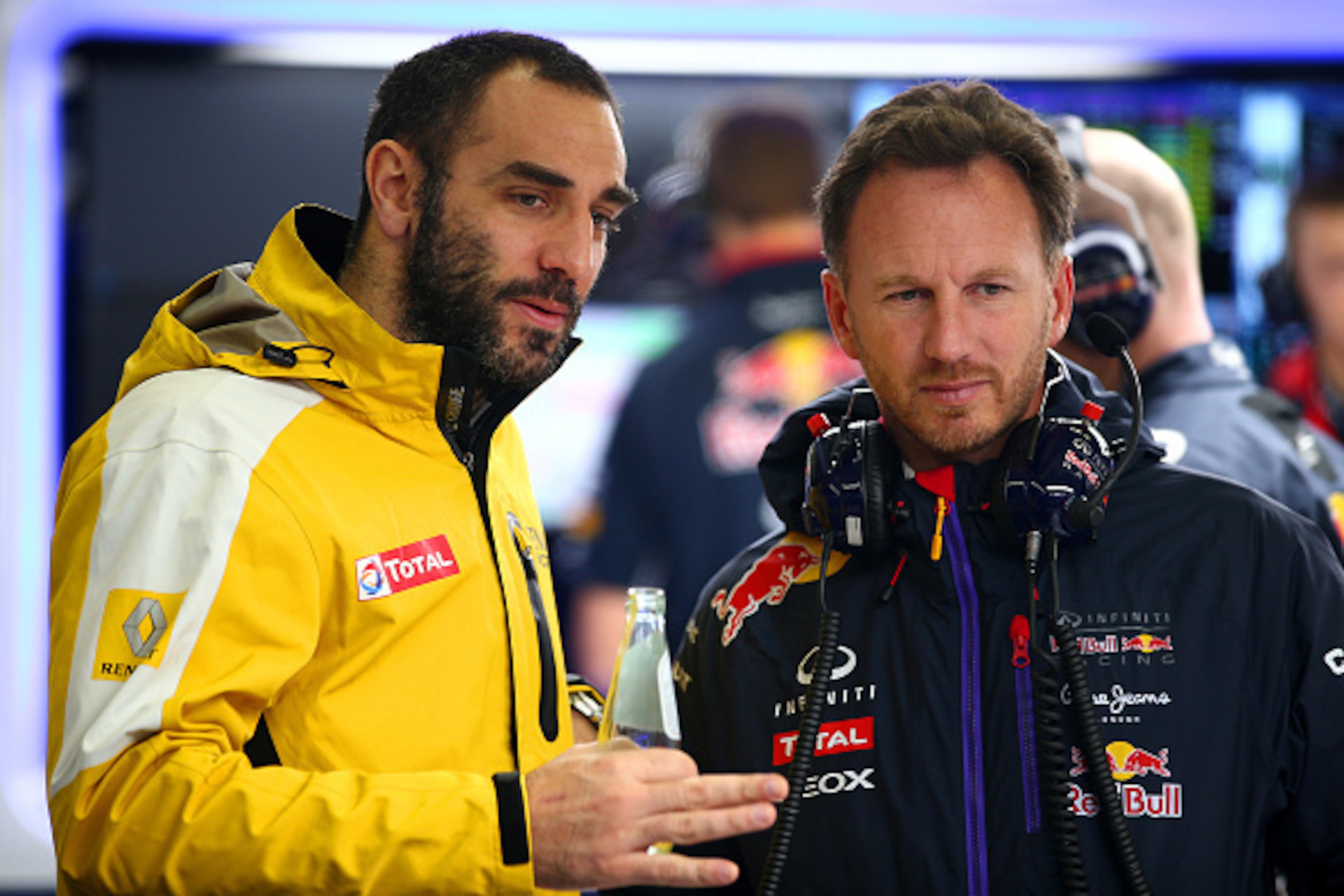JEREZ DE LA FRONTERA, SPAIN - FEBRUARY 03:  Infiniti Red Bull Racing Team Principal Christian Horner speaks with Renault's Cyril Abiteboul in the garage during day three of Formula One Winter Testing at Circuito de Jerez on February 3, 2015 in Jerez de la
