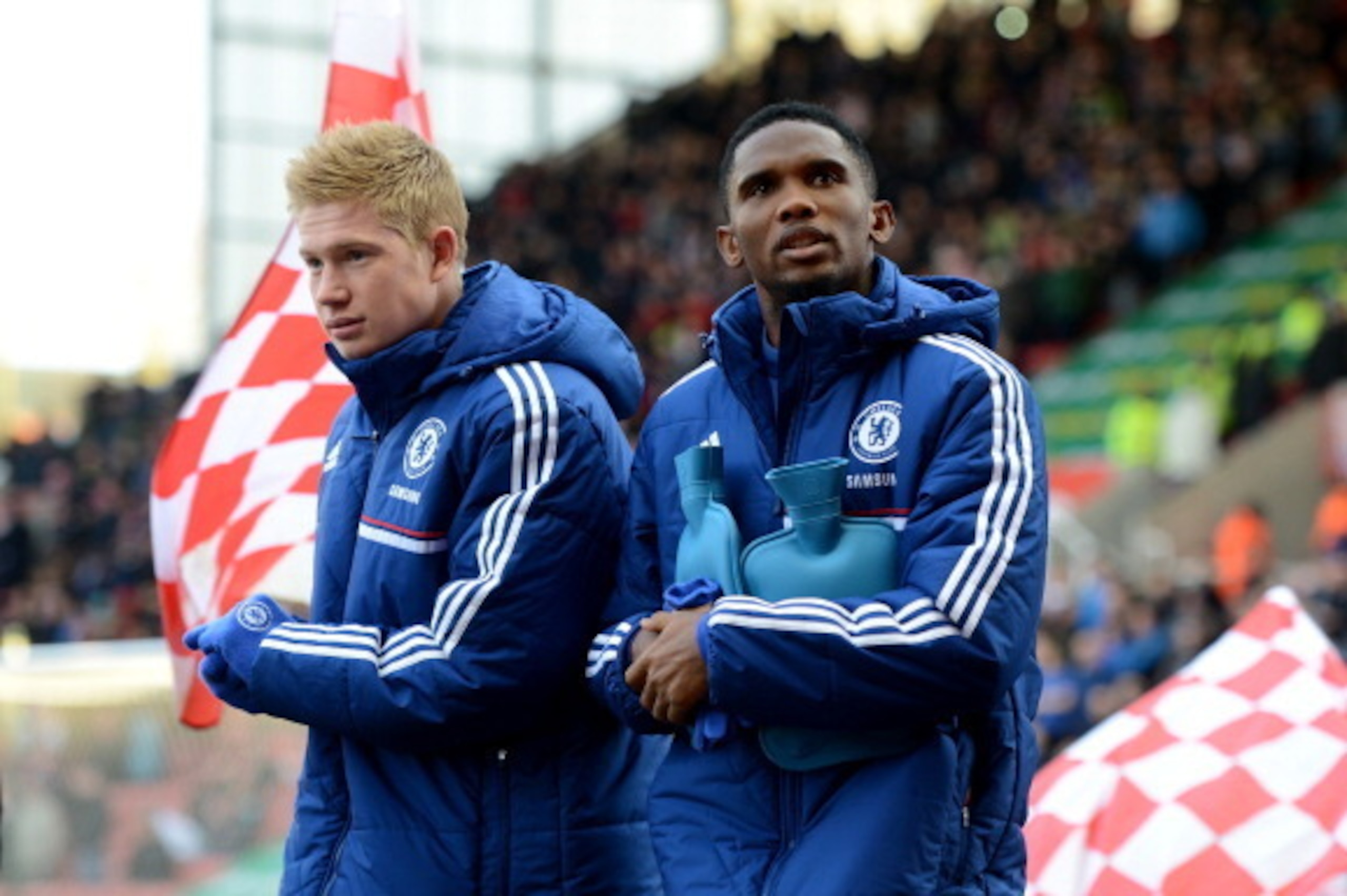 STOKE ON TRENT, ENGLAND - DECEMBER 07: Chelsea substitutes Kevin De Bruyne and Samuel Eto'o walk out onto the pitch clutching hotwater bottles during the Barclays Premier League match between Stoke City and Chelsea at Britannia Stadium on December 7, 20 STOKE ON TRENT, ENGLAND - DECEMBER 07: Chelsea substitutes Kevin De Bruyne and Samuel Eto'o walk out onto the pitch clutching hotwater bottles during the Barclays Premier League match between Stoke City and Chelsea at Britannia Stadium on December 7, 20
