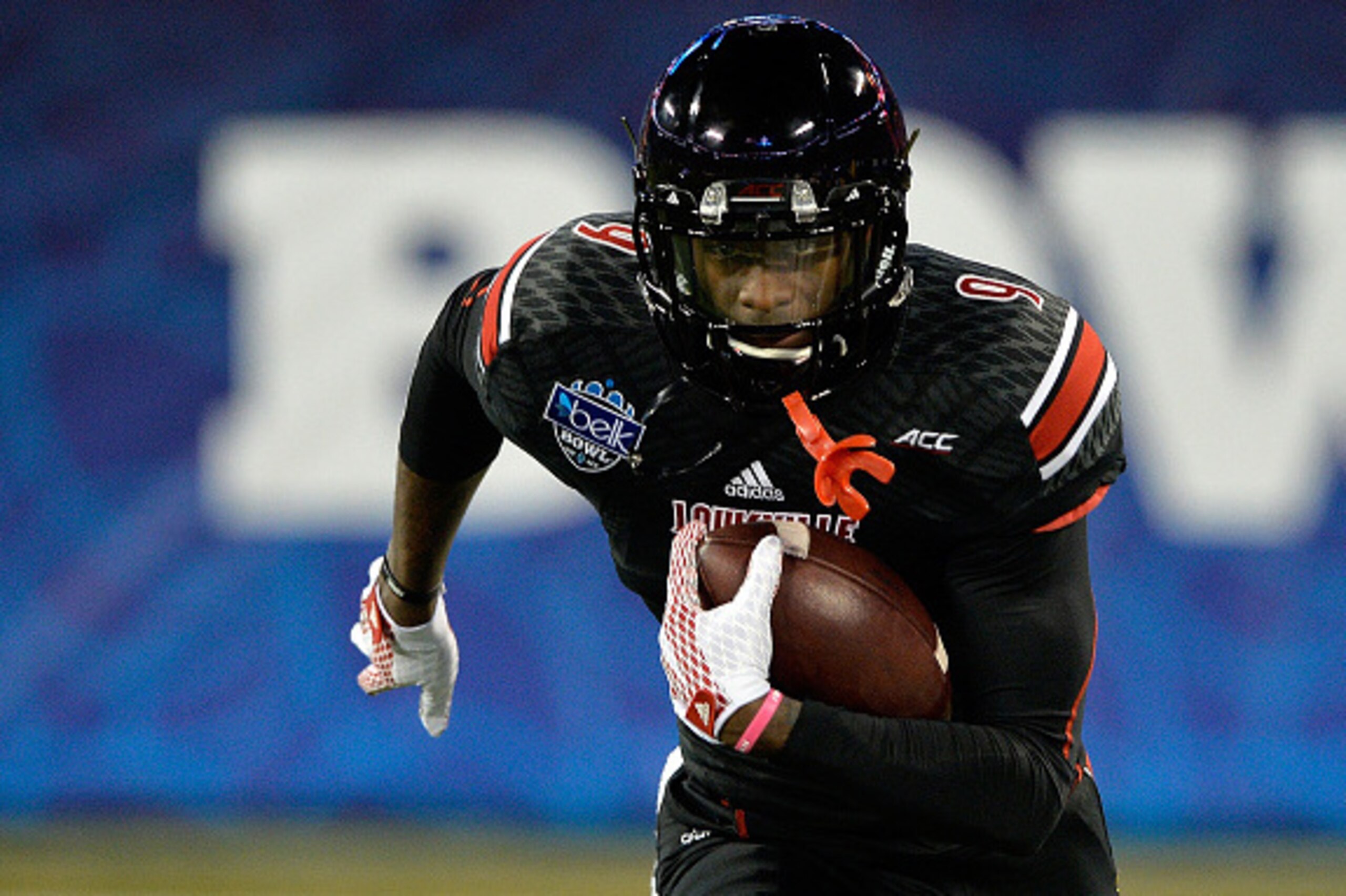 CHARLOTTE, NC - DECEMBER 30:  DeVante Parker #9 of the Louisville Cardinals warms up before the Belk Bowl against the Georgia Bulldogs at Bank of America Stadium on December 30, 2014 in Charlotte, North Carolina.  (Photo by Grant Halverson/Getty Images)